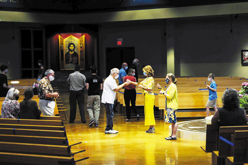 Parishes welcome their congregations back to Mass