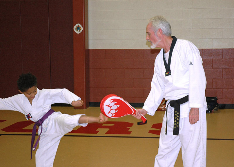 Read more about the article With martial arts, priest helps students make body, mind, soul connection 
