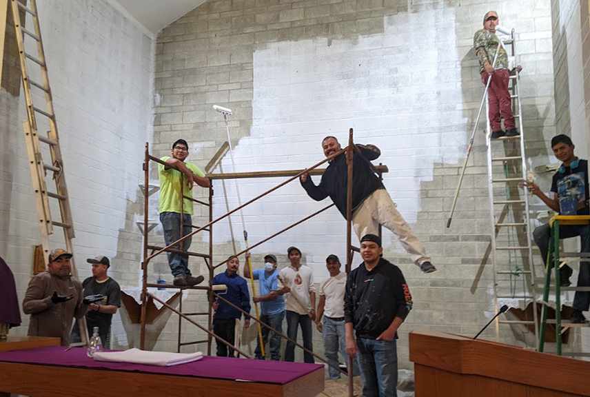 St. Catherine parishioners chip in to paint the church